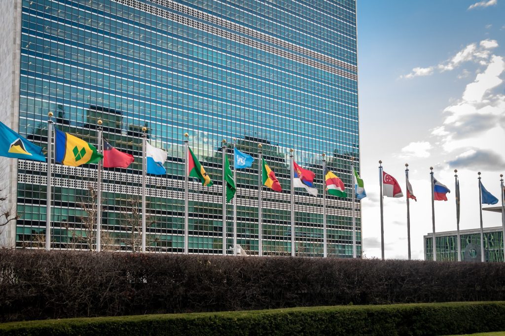 Photo of the UN HQ in New York with flags of member states.