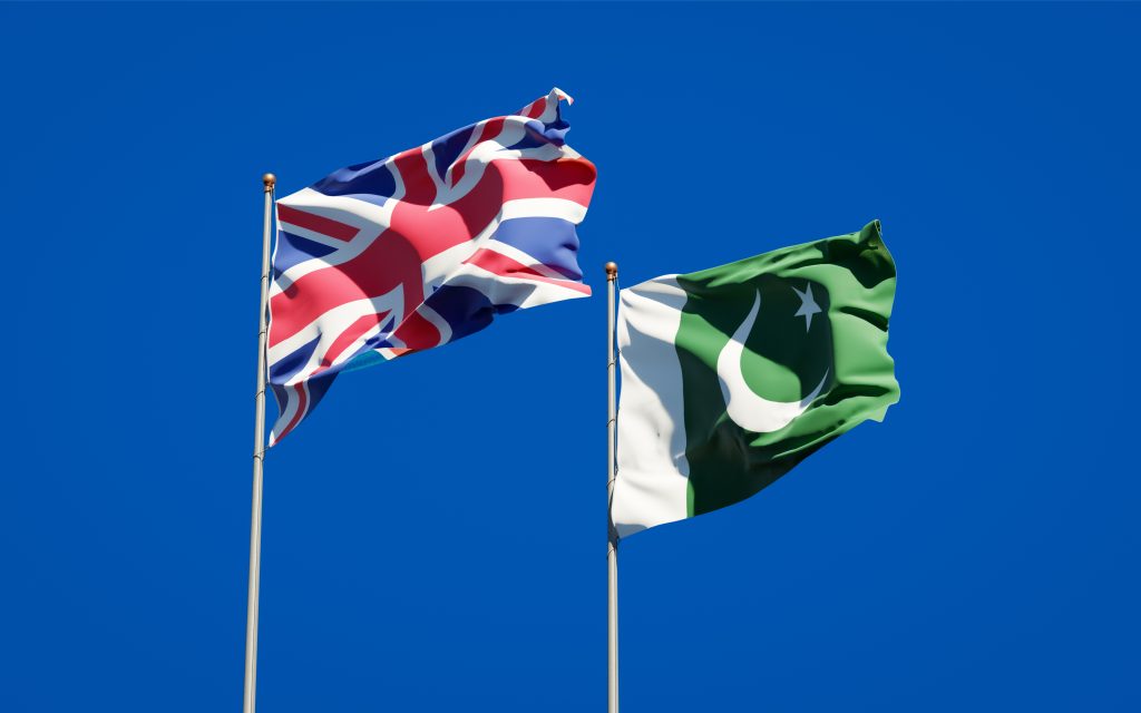 National state flags of UK and Pakistan together at the sky background. 3D artwork concept.