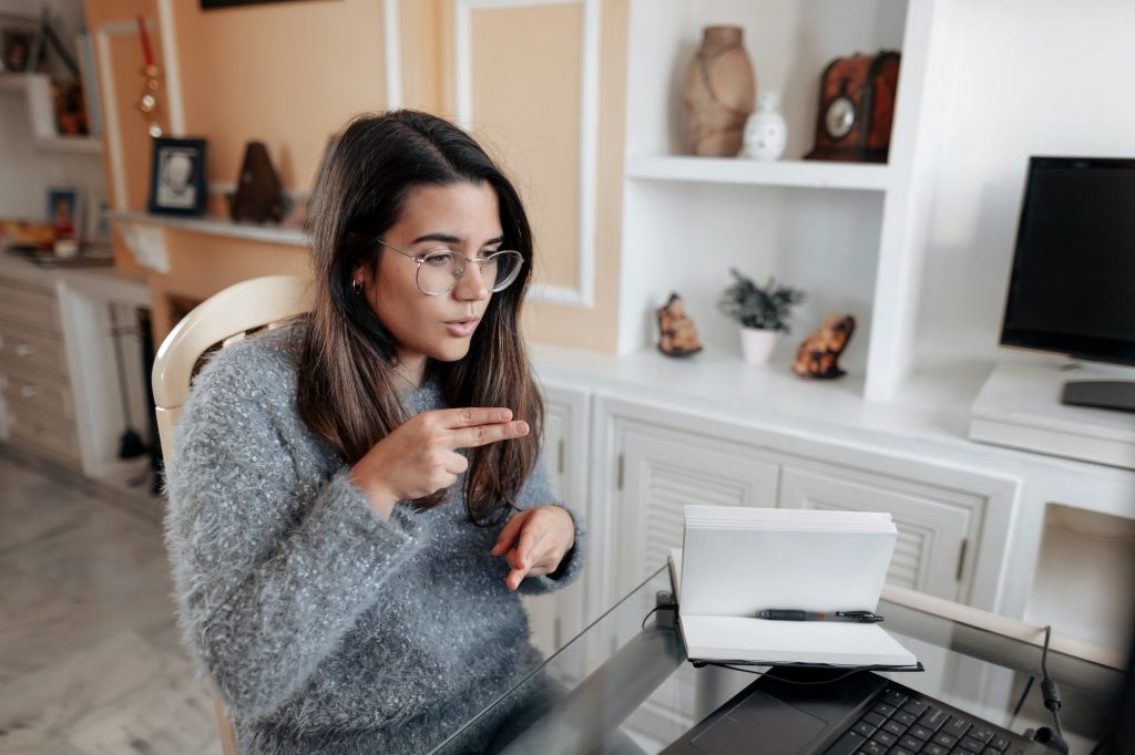  Adult, Female, Person, Woman, Head, Face, Computer, Computer Hardware, Computer Keyboard, Electronics, Hardware, Furniture, Table, Monitor, Screen, Desk, Executive