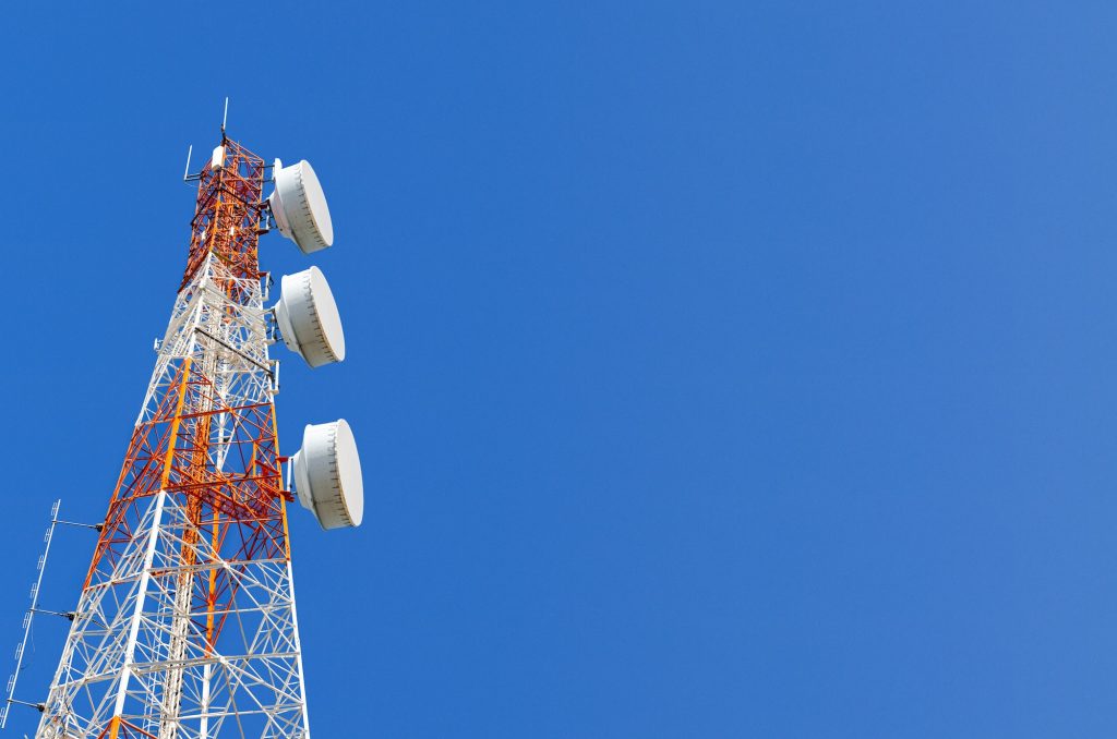 Telecommunication tower on blue sky background