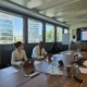  People, Person, Adult, Male, Man, Electronics, Mobile Phone, Phone, Indoors, Female, Woman, Accessories, Glasses, Computer, Laptop, Pc, Formal Wear, Tie, Crowd, Document, Text, Computer Hardware, Hardware, Monitor, Screen, Executive, Chair, Furniture, Terry Crews