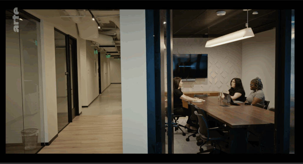 Indoors, Interior Design, Floor, Flooring, Adult, Female, Person, Woman, Wood, Electronics, Screen, Chair, Furniture, Computer Hardware, Hardware, Monitor, Office, Head, Face, Faith Muthambi, Andrea Begley