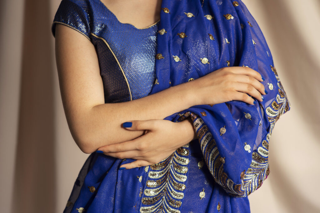 The Banana AI saree edit transforms selfies into nostalgic portraits, with chiffon sarees, grainy textures, and retro cinematic flair.
