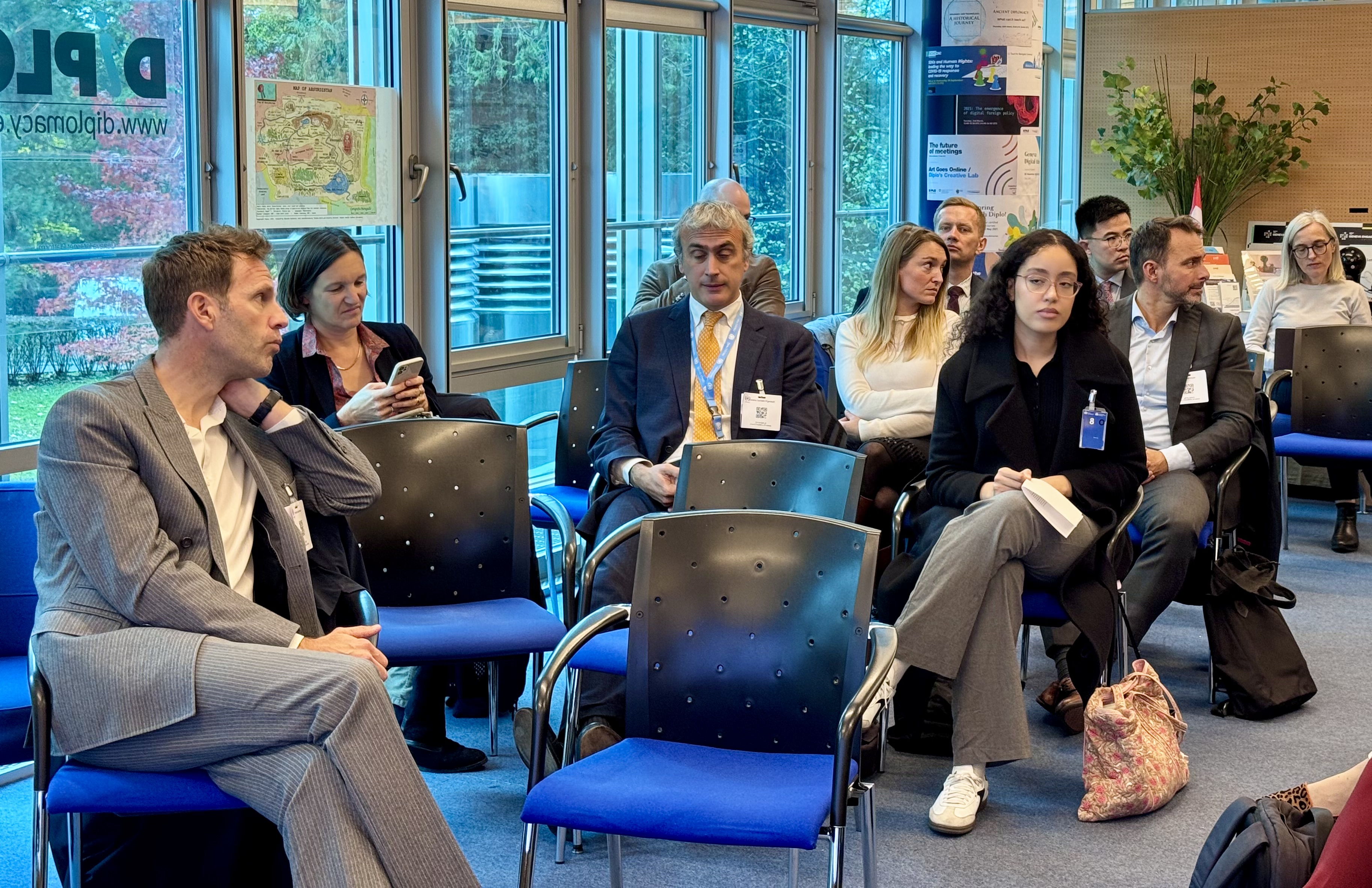 IMG_4128 People, Person, Adult, Male, Man, Female, Woman, Clothing, Footwear, Shoe, Accessories, Glasses, Bag, Handbag, Formal Wear, Tie, Wristwatch, Jewelry, Necklace, Electronics, Mobile Phone, Phone, Chair, Furniture, Crowd, Face, Head, Computer Hardware, Hardware, Monitor, Screen, Indoors, Suit, Lucas Bernardi, Benito Floro, Rachel Whetstone, Clemens Meyer