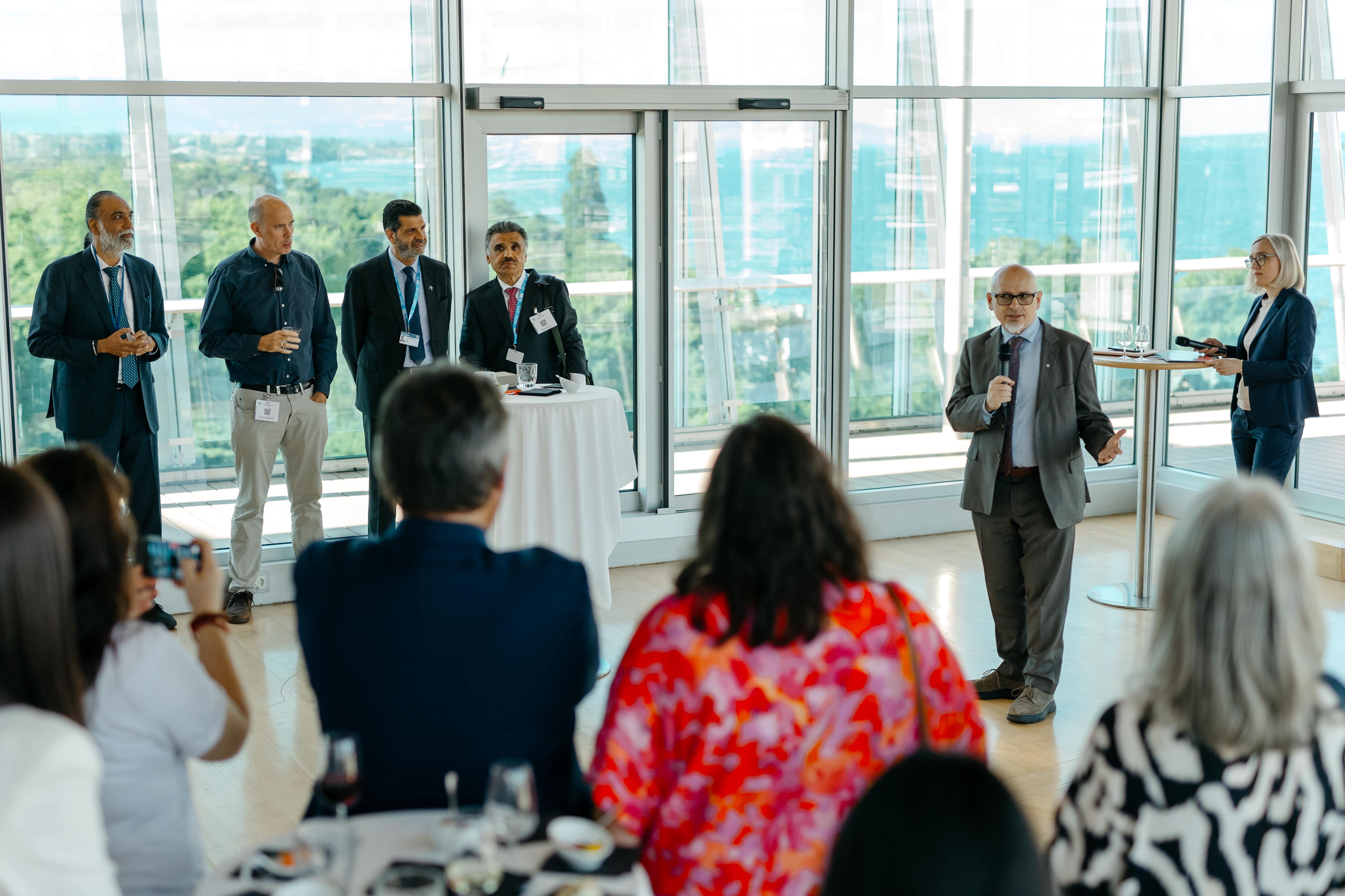 LAZA1895-min Adult, Female, Person, Woman, Crowd, Male, Man, Clothing, Footwear, Shoe, Accessories, Glasses, Audience, Formal Wear, Tie, Coat, Camera, Electronics, Speech, Cup, Suit, People, Adé Bantu, Shivraj Patil, Mike Golic