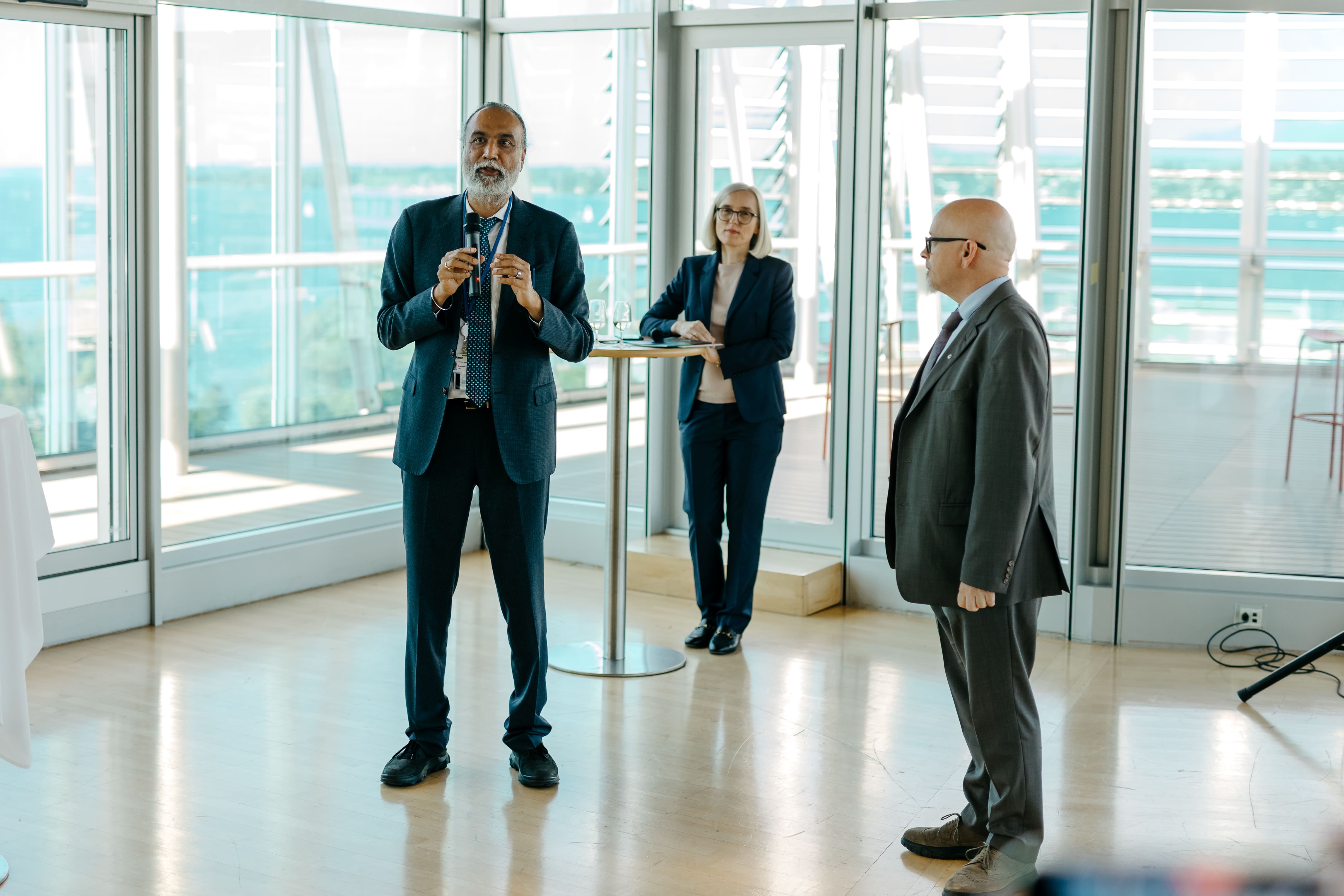 LAZA1973-min Adult, Female, Person, Woman, Male, Man, Accessories, Glasses, Clothing, Coat, Groupshot, Footwear, Shoe, Formal Wear, Tie, Monika Henzinger