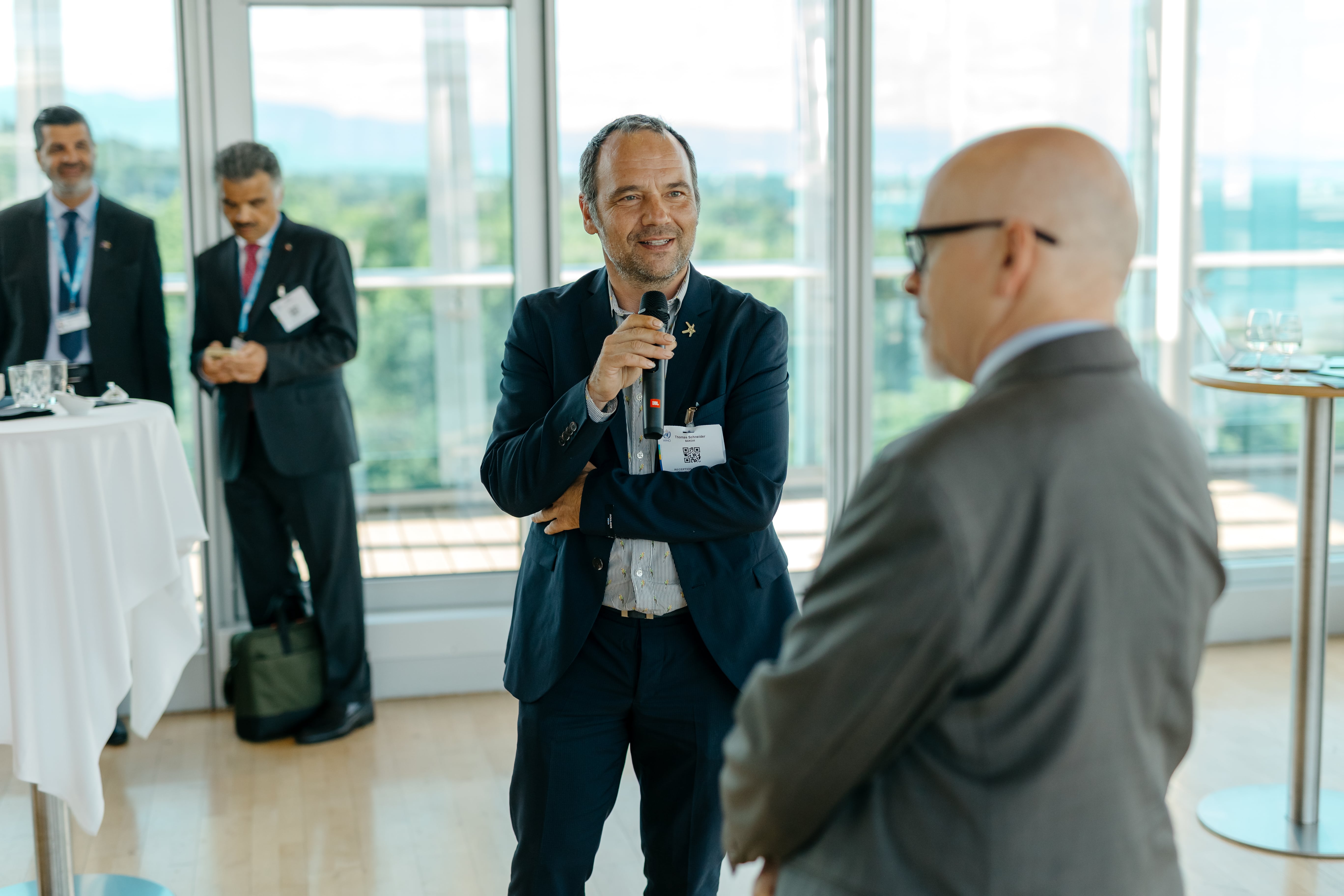 LAZA2032-min Accessories, Bag, Handbag, Crowd, Person, Adult, Male, Man, Clothing, Footwear, Shoe, Glasses, Coat, Formal Wear, Tie, Head, Electrical Device, Microphone, Audience, Face, People, Belt, Speech, Stephan Bodzin, Giuseppe Iachini