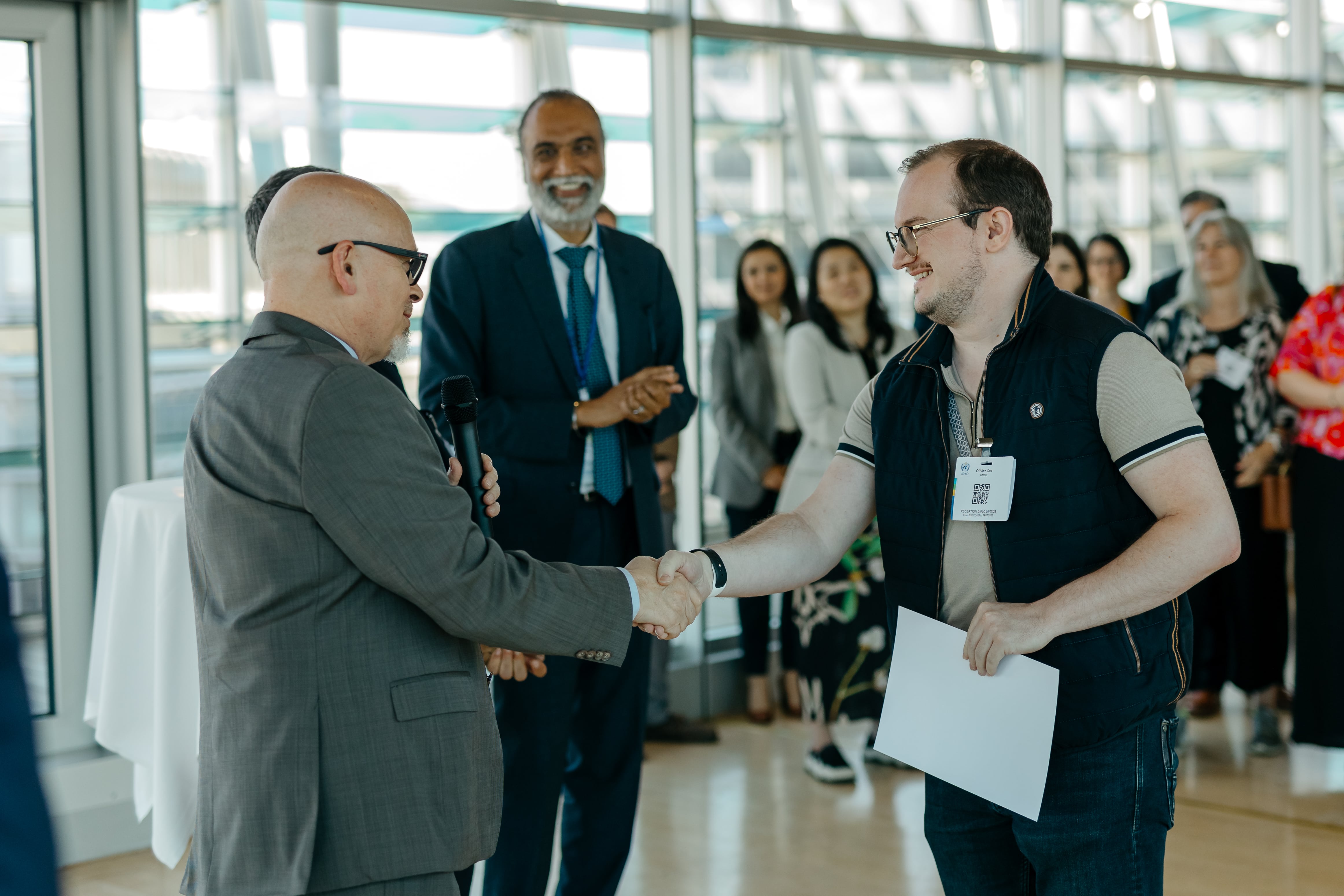 LAZA2084-min Accessories, Glasses, Formal Wear, Tie, Electrical Device, Microphone, Clothing, Footwear, Shoe, Adult, Male, Man, Person, Bag, Handbag, Suit, Coat, Babar Khan Ghauri, Tatiana Nikolayeva