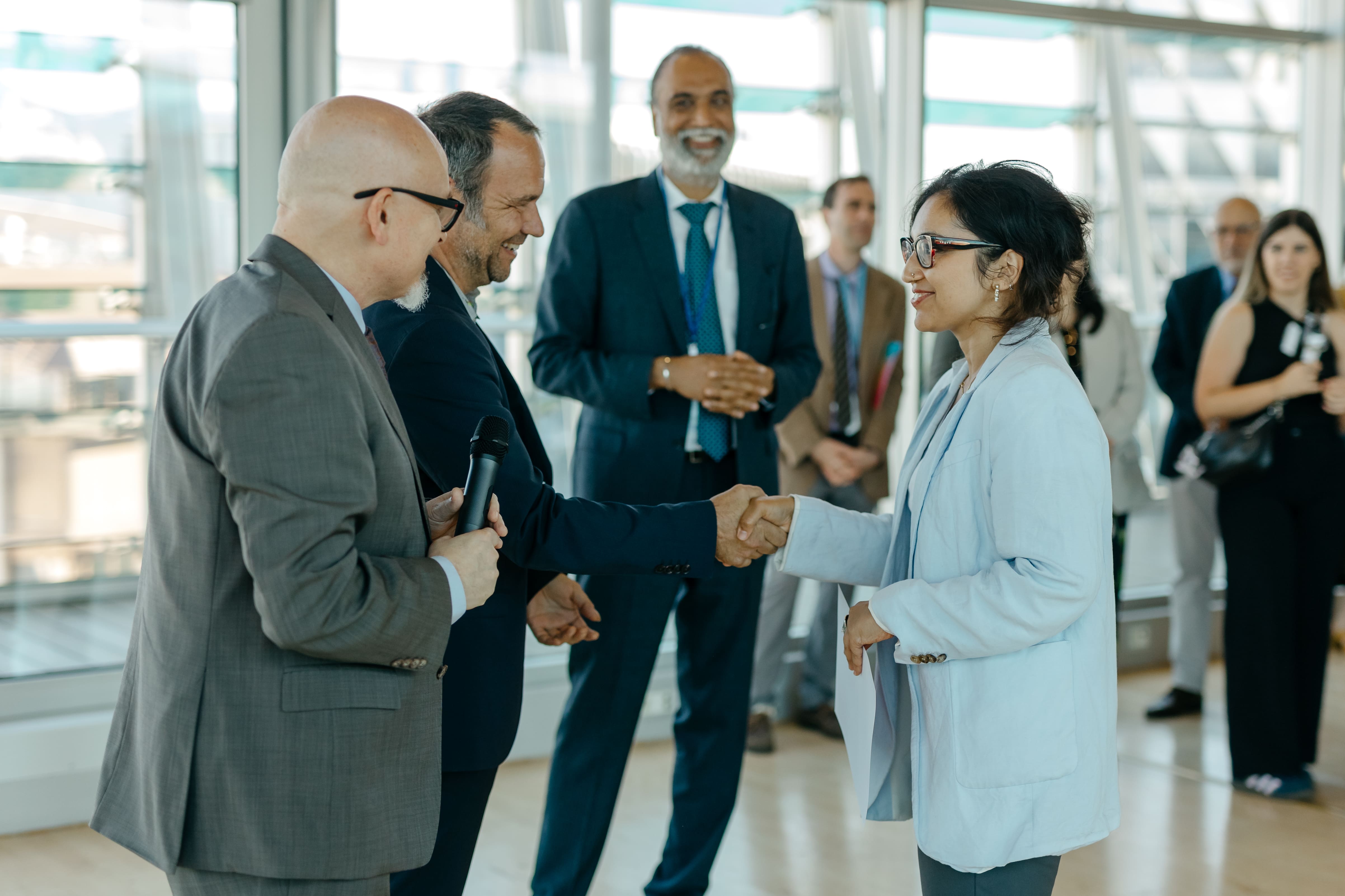 LAZA2112-min Accessories, Bag, Handbag, Adult, Male, Man, Person, Glasses, Female, Woman, Clothing, Footwear, Shoe, Formal Wear, Tie, Electrical Device, Microphone, Wristwatch, Executive, Peter Berner, Mohsin Issa