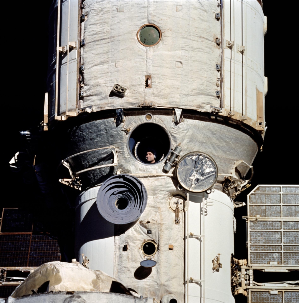 Space as a test of civilisation: Will the race to the stars unite or divide humanity? 2 The image shows a photograph of a man looking out from a space station.