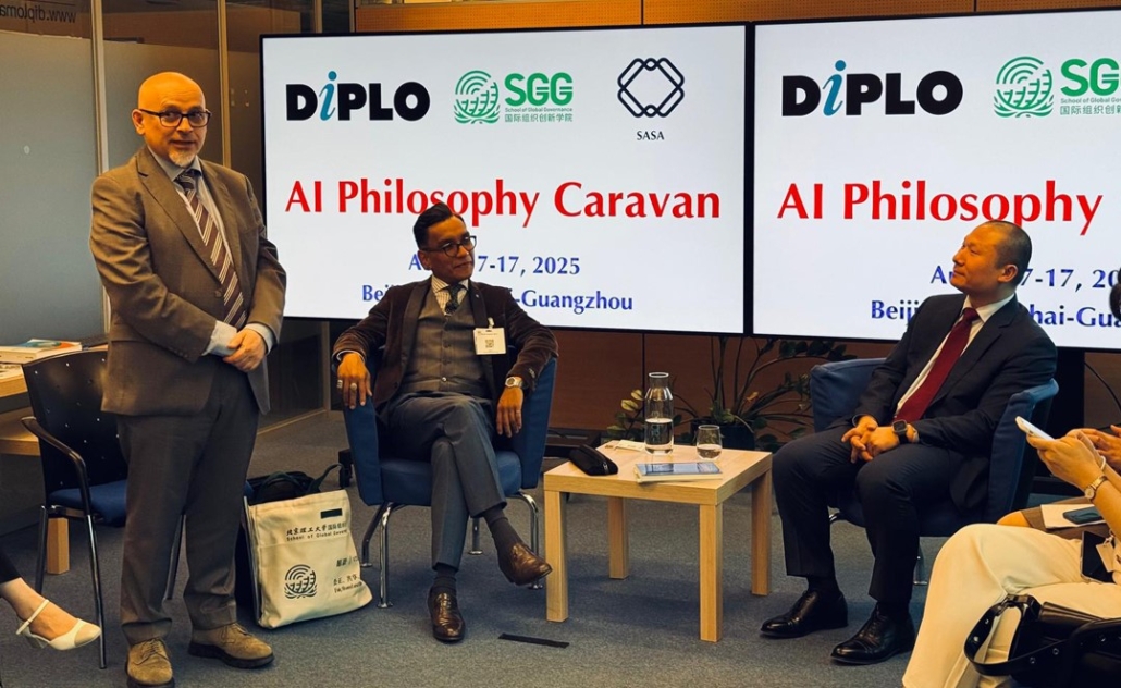 Adult, Female, Person, Woman, Conversation, Male, Man, Interview, Crowd, Accessories, Bag, Handbag, Clothing, Footwear, Shoe, Formal Wear, Tie, Chair, Furniture, Coat, Suit, Face, Head, Glove, Audience, Ji Chunhua, Mohd Faiz Subri