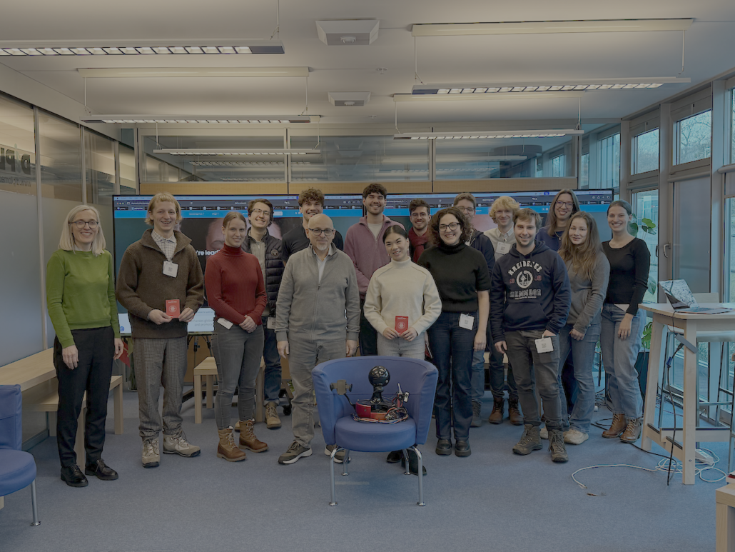 Meeting with students and I'Quvalo, non-antrophomor representation of AI.