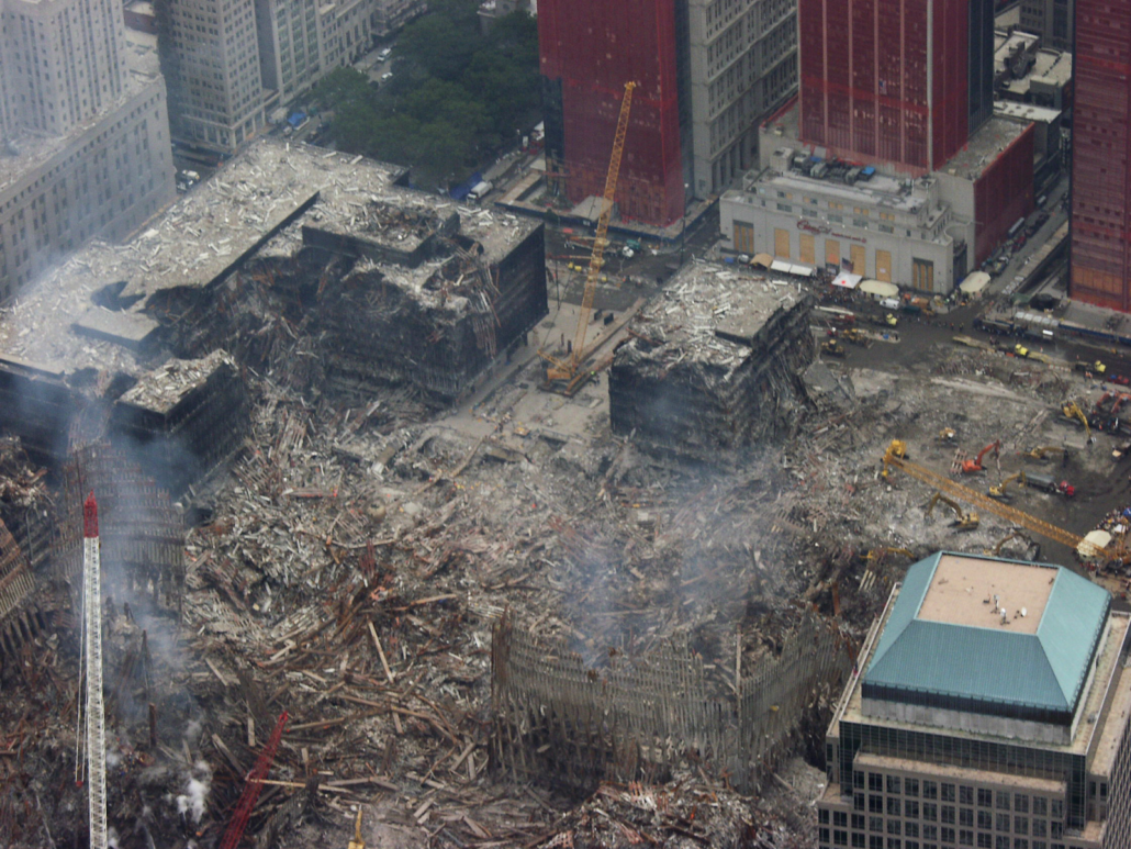 Do catchwords pollute more than plastic? 2 The image shows an aerial photograph of the wreckage of building collapse in an urban environment