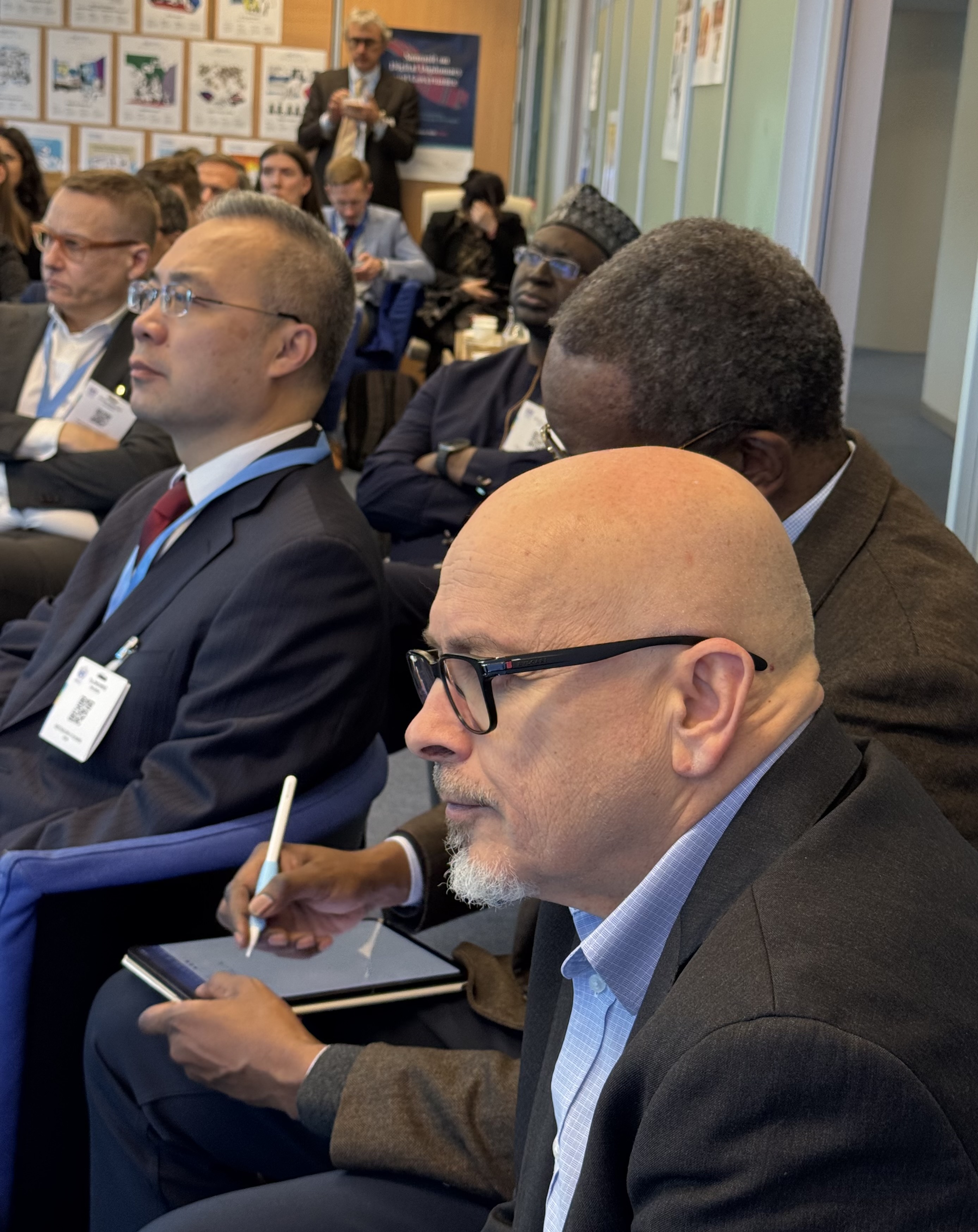 IMG_5522 People, Person, Pen, Adult, Male, Man, Accessories, Glasses, Wristwatch, Clothing, Hat, Formal Wear, Tie, Suit, Crowd, Face, Head, Indoors, Audience, Lecture, Room, Seminar, Bag, Handbag, Lamine Guèye, Angelina Grimké