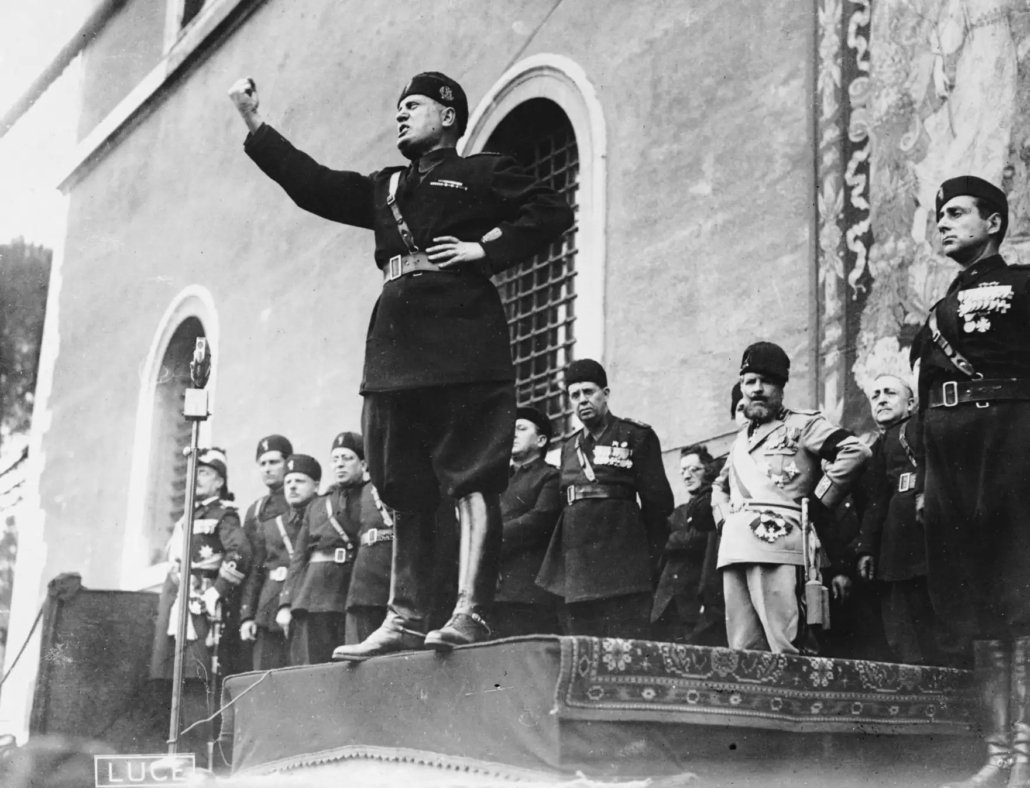The Tytler Cycle myth: Why democracies do not inevitably collapse 2 The image shows a black and white photograph of Benito Mussolini, Italian dictator and founder of fascism, delivering a public speech.