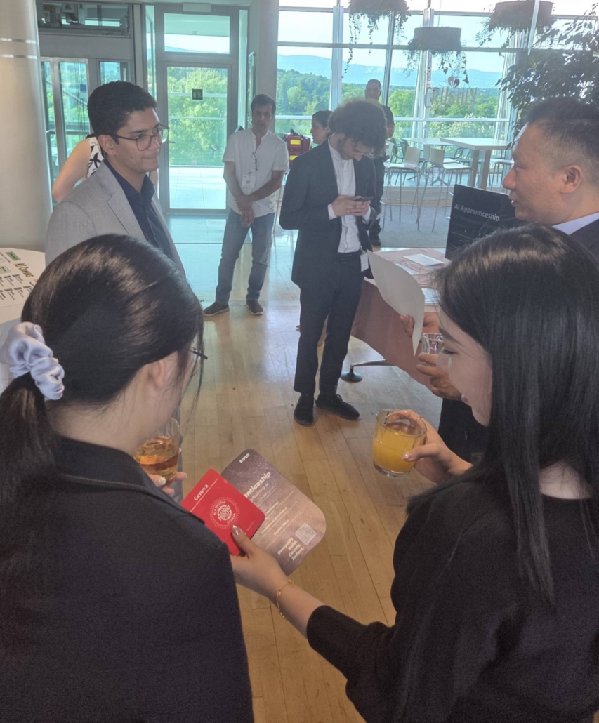 A photograph of conference attendees in discussion