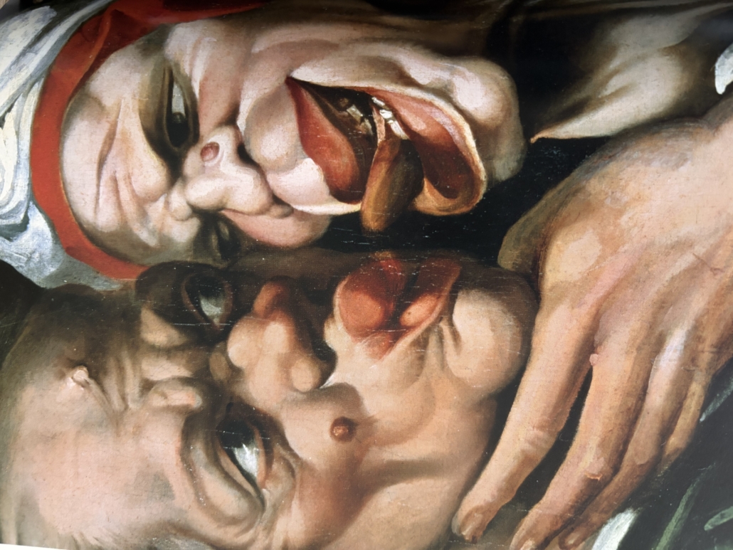 The image shows a painting of two grotesque faces